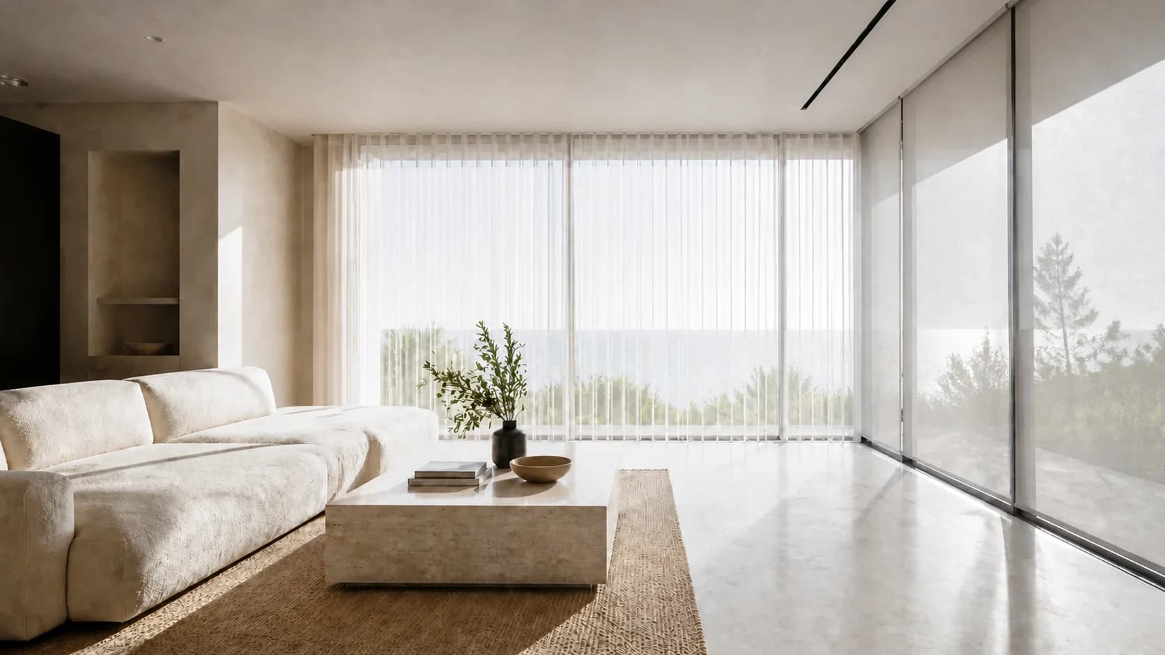 Neutral-toned Costa del Sol living room with tailored ivory sheers and solar screens